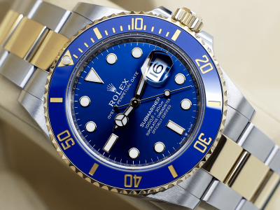 Rolex Submariner 18ct yellow gold and stainless steel 41mm watch with a blue dial and blue ceramic bezel